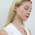 Model wearing Halo Kaleidoscope CZ Fish Hook Earrings in Sterling Silver, Red Orange Color