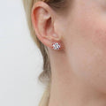 Model wearing Flower CZ Stud Earrings in Sterling Silver, Rose Gold Flashed