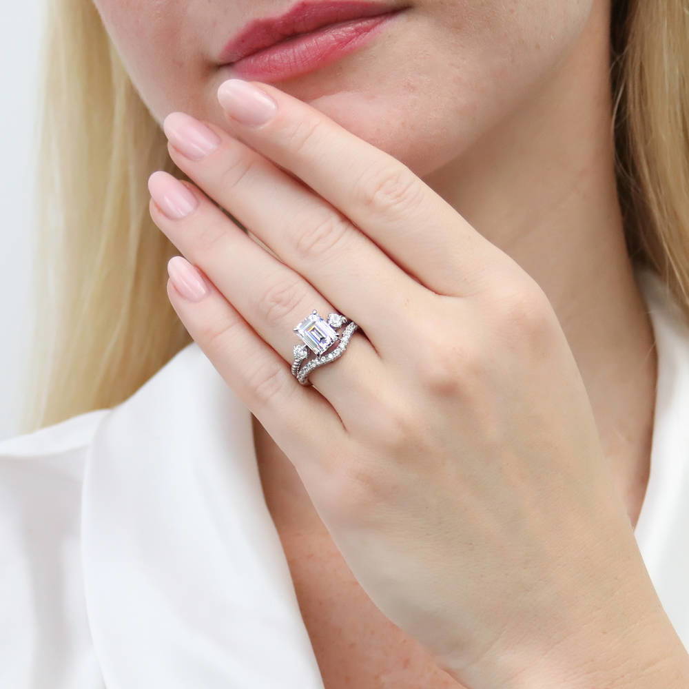 Model wearing 3-Stone Woven 2.6ct Emerald Cut CZ Ring in Sterling Silver, 11 of 19