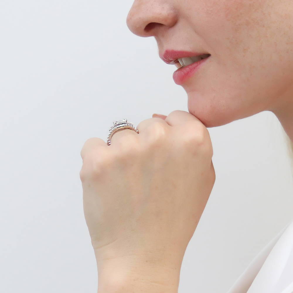 Model wearing 3-Stone Woven 2.6ct Emerald Cut CZ Ring in Sterling Silver, 15 of 19