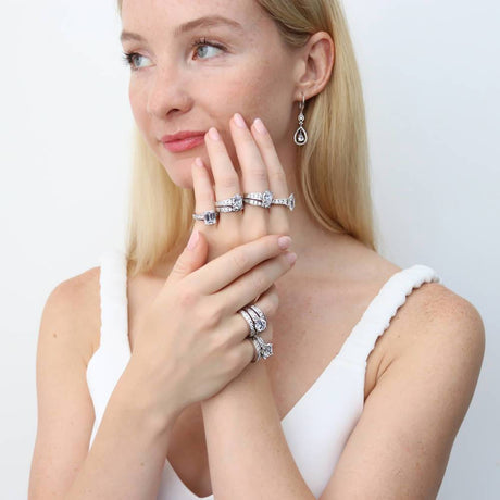 Image Contain: Model Wearing Cable Dangle Earrings, Curved Half Eternity Ring, Solitaire with Side Stones Ring
