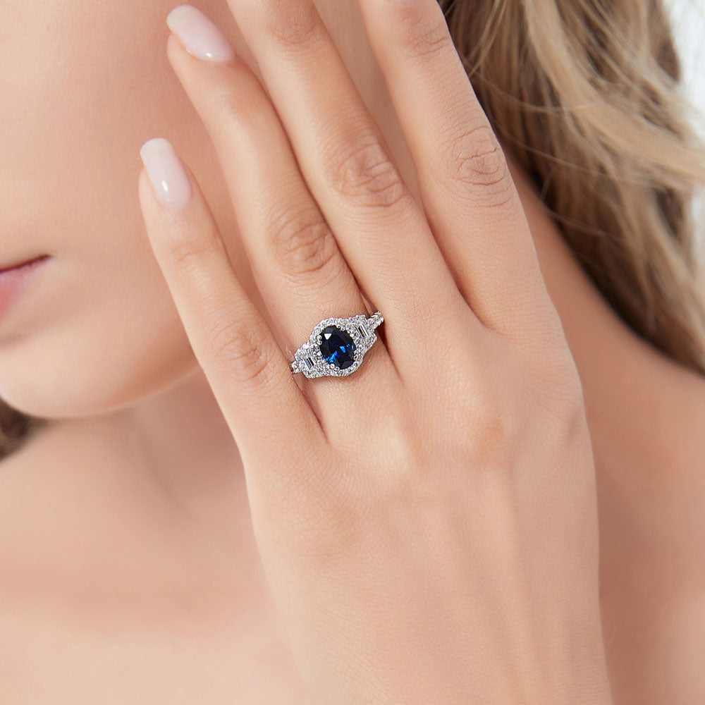 3-Stone Halo Simulated Blue Sapphire Oval CZ Ring in Sterling Silver