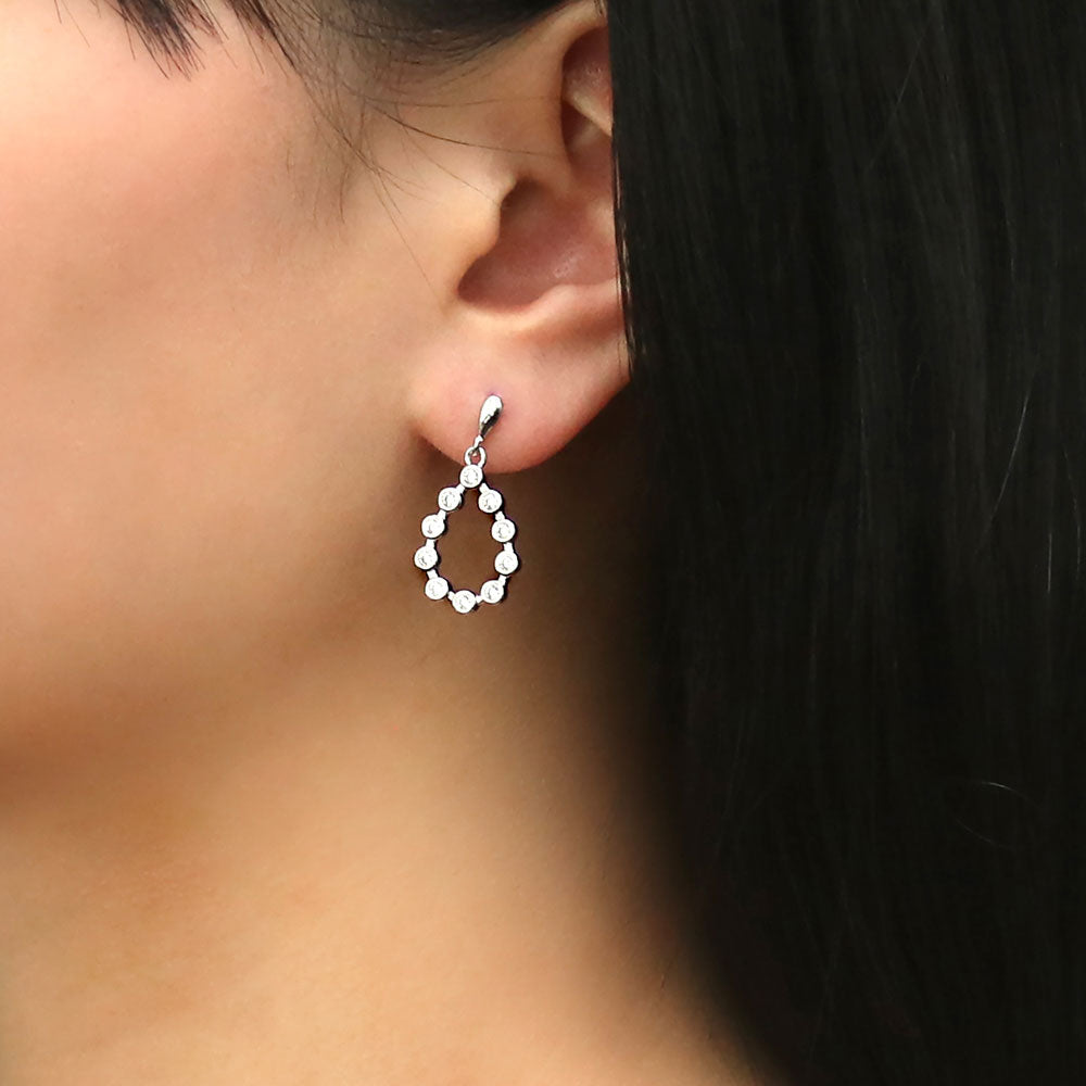 Model wearing Bubble Teardrop CZ Earrings in Sterling Silver, 2 of 2