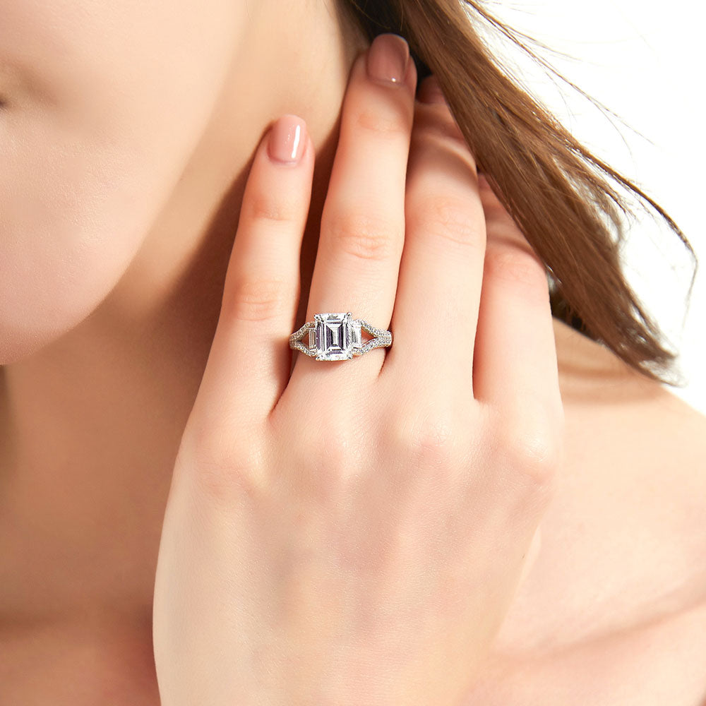 Model wearing Solitaire Emerald Cut CZ Split Shank Ring in Sterling Silver, 2 of 8