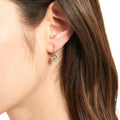 Model wearing Solitaire 1.2ct Bezel CZ Leverback Earrings in Sterling Silver, Rose Gold Flashed