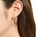 Model wearing Dome Medium Hoop Earrings in Sterling Silver 1 inch, Yellow Gold Flashed