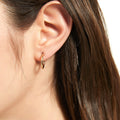 Model wearing Small Hoop Earrings in Sterling Silver 0.58 inch, Yellow Gold Flashed