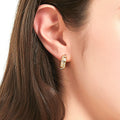 Model wearing Checkerboard CZ Medium Hoop Earrings in Sterling Silver 0.6 inch, Yellow Gold Flashed