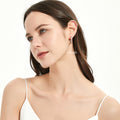 Model wearing Bar CZ Medium Hoop Earrings in Sterling Silver, 0.8 inch