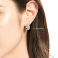 Model wearing Dome CZ Medium Hoop Earrings in Sterling Silver, 0.62 inch