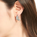 Model wearing Feather CZ Necklace and Earrings in Sterling Silver, Rhodium Plated