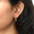 Model wearing Woven Medium Hoop Earrings in Sterling Silver 0.72 inch, Yellow Gold Flashed