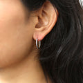 Model wearing Cable Hoop Earrings in Sterling Silver, 2 Pairs, Rhodium Plated