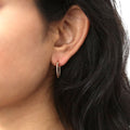 Model wearing Cable Hoop Earrings in Sterling Silver, 2 Pairs, Yellow Gold Flashed