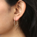 Model wearing Cable Hoop Earrings in Sterling Silver, 2 Pairs, Yellow Gold Flashed