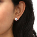 Model wearing Flower CZ Stud Earrings in Sterling Silver, Rhodium Plated