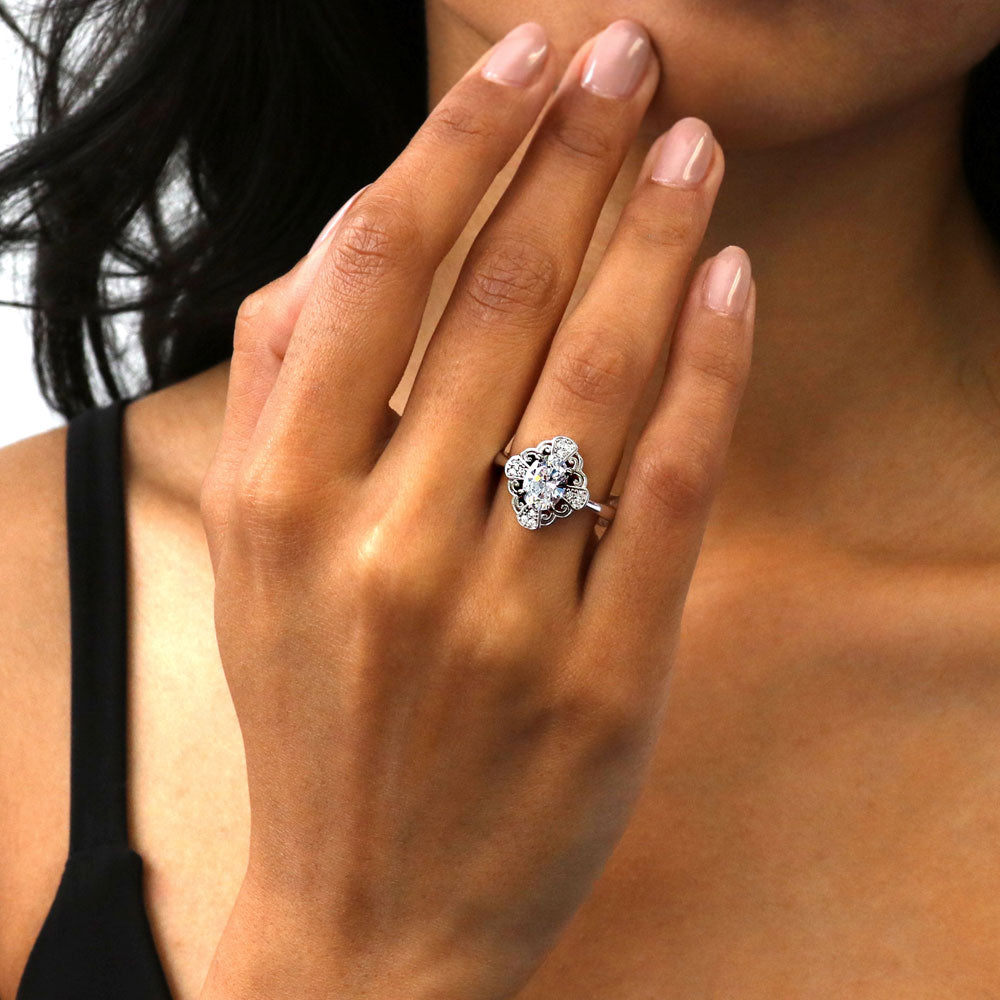 Model wearing Halo Flower Art Deco Oval CZ Ring in Sterling Silver, 3 of 8