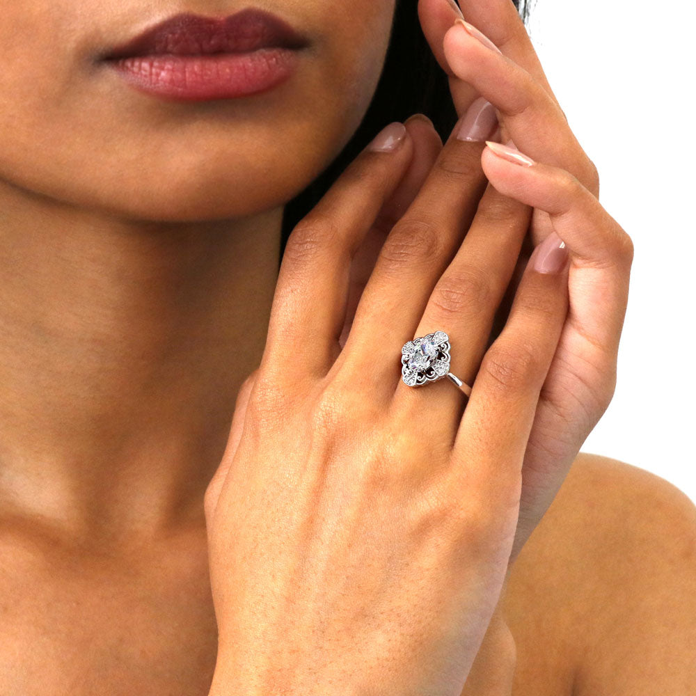 Model wearing Halo Flower Art Deco Oval CZ Ring in Sterling Silver, 2 of 8