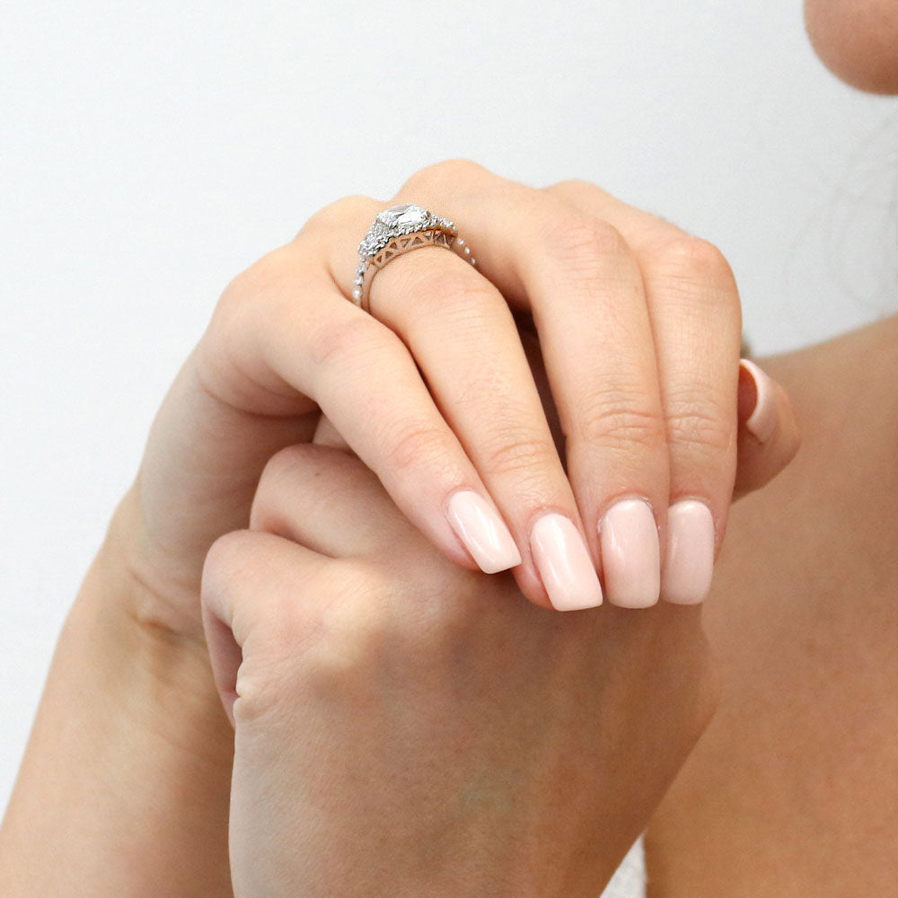 Model wearing 3-Stone Halo Art Deco 2ct Cushion CZ Ring in Sterling Silver, 9 of 11
