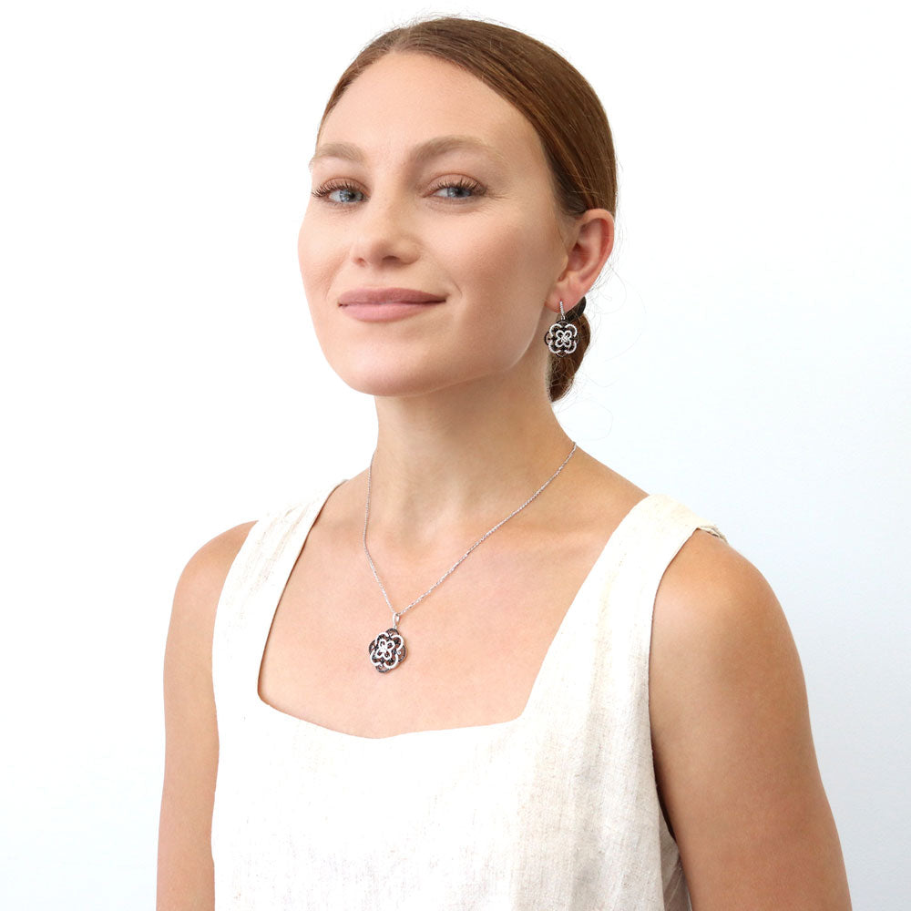 Model wearing Flower Black and White CZ Earrings in Sterling Silver, 7 of 7