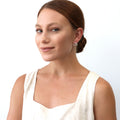 Model wearing Cluster Wrap CZ Stud Earrings in Sterling Silver, Yellow Gold Flashed