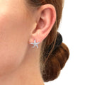 Model wearing Starfish CZ Stud Earrings in Sterling Silver, Yellow Gold Flashed