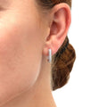 Model wearing Rectangle CZ Medium Hoop Earrings in Sterling Silver 0.62 inch, Yellow Gold Flashed