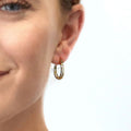 Model wearing Filigree Medium Hoop Earrings in Sterling Silver 0.75 inch, Yellow Gold Flashed