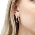 Model wearing CZ Medium Inside-Out Hoop Earrings in Sterling Silver 1 inch, Yellow Gold Flashed