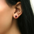 Model wearing Solitaire CZ Stud Earrings in Sterling Silver 2.5ct, Red Color