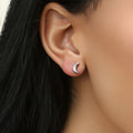 Model wearing Crescent Moon Stud Earrings in Sterling Silver, Yellow Gold Flashed