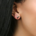 Model wearing Crescent Moon Stud Earrings in Sterling Silver, Yellow Gold Flashed