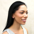 Model wearing Crescent Moon Stud Earrings in Sterling Silver, Yellow Gold Flashed