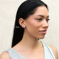 Model wearing Solitaire CZ Stud Earrings in Gold Flashed Sterling Silver, 5mm