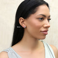 Model wearing Solitaire CZ Stud Earrings in Gold Flashed Sterling Silver, 8mm