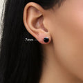 Model wearing Solitaire Black CZ Stud Earrings in Sterling Silver, 7mm