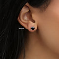 Model wearing Solitaire Black CZ Stud Earrings in Sterling Silver, 6mm