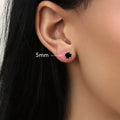 Model wearing Solitaire Black CZ Stud Earrings in Sterling Silver, 4mm