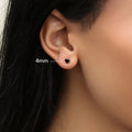 Model wearing Solitaire Black CZ Stud Earrings in Sterling Silver, 4mm