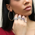 Model wearing CZ Large Inside-Out Hoop Earrings in Sterling Silver 2.5 inch, Yellow Gold Flashed