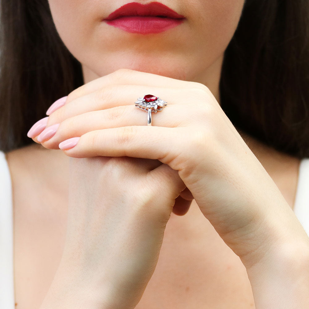 Model wearing Heart Flower Ruby-Red CZ Ring in Sterling Silver, 7 of 9