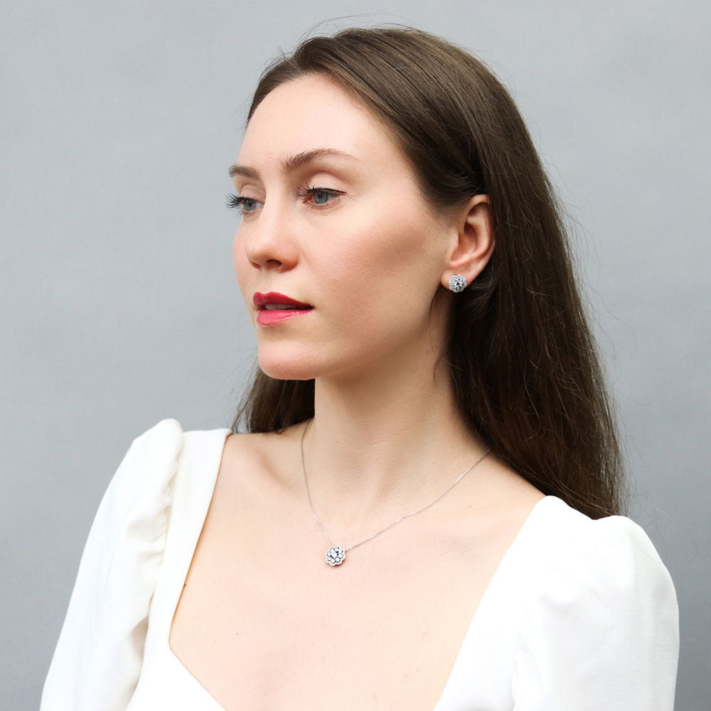 Model wearing Flower Halo CZ Stud Earrings in Sterling Silver, 3 of 7