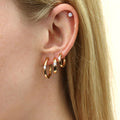 Model wearing Solitaire CZ Stud Earrings in Gold Flashed Sterling Silver, 4mm