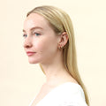 Model wearing Solitaire CZ Stud Earrings in Gold Flashed Sterling Silver, 4mm