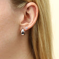 Model wearing Dome Hoop Earrings in Sterling Silver, 2 Pairs, Rhodium Plated