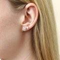 Model wearing Solitaire CZ Stud Earrings in Gold Flashed Sterling Silver, 4mm