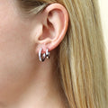 Model wearing Bar CZ Medium Hoop Earrings in Sterling Silver 0.64 inch, Rhodium Plated