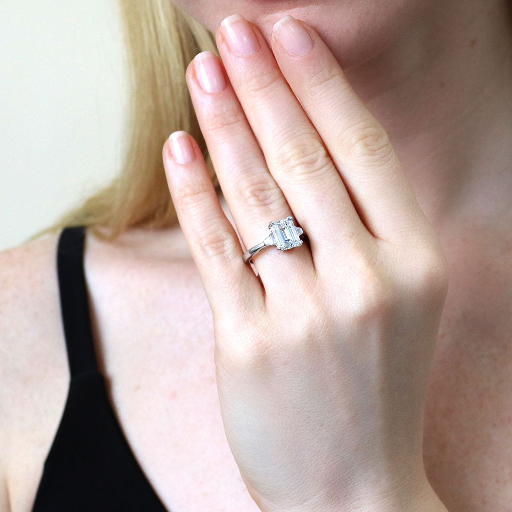 Model wearing 3-Stone 2.6ct Emerald Cut CZ Ring in Sterling Silver, 2 of 10