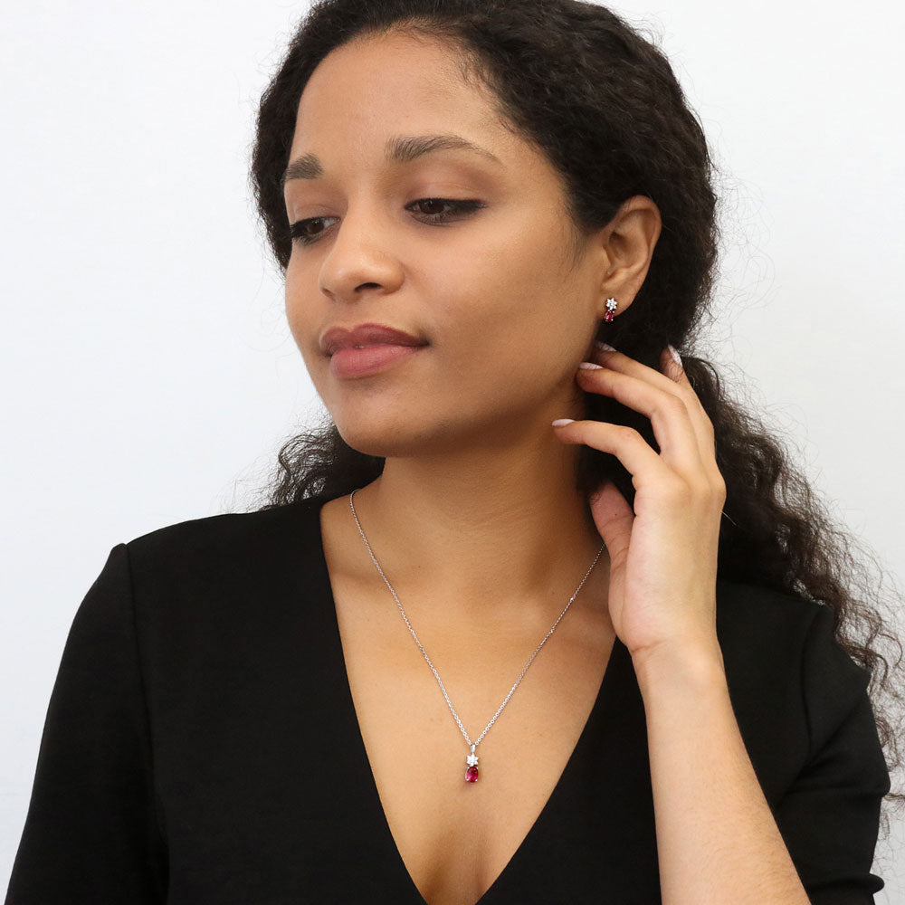 Model wearing Flower Ruby-Red CZ Stud Earrings in Sterling Silver, 5 of 5