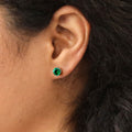 Model wearing Solitaire CZ Stud Earrings in Sterling Silver 1.6ct, Emerald Color